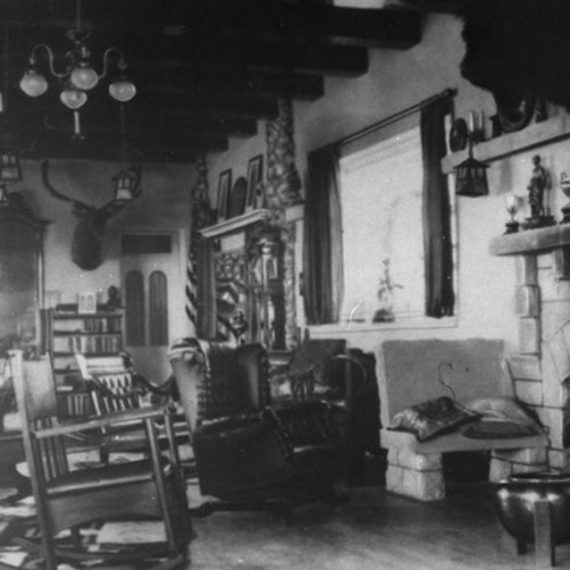 The Mansion’s living room has seen many changes over the years. This photo was taken sometime during John Springer’s ownership from 1897-1913, and shows a window where the arched doorway into the dining room now sits.