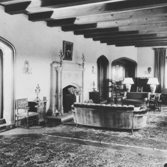 The Mansion's living room received its final transformation during Frank Kistler's 1926-1937 ownership, with the addition of large arched doorways and an intricately carved travertine mantle.