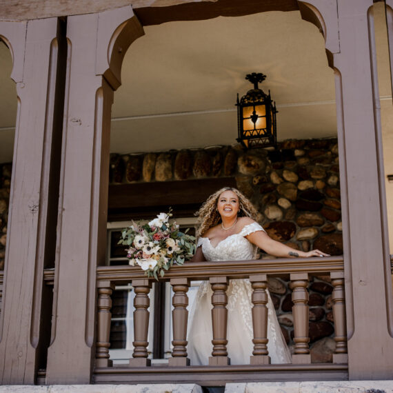 A bride overlooks the west balcony.