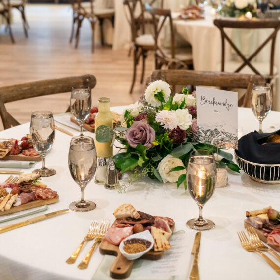 Mini charcuterie boards around a table in the Great Hall.