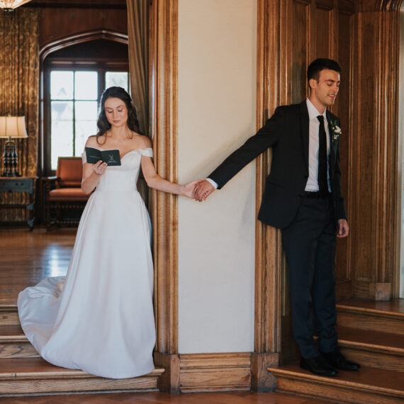 Bride reads her vows to the groom in the Living Room.