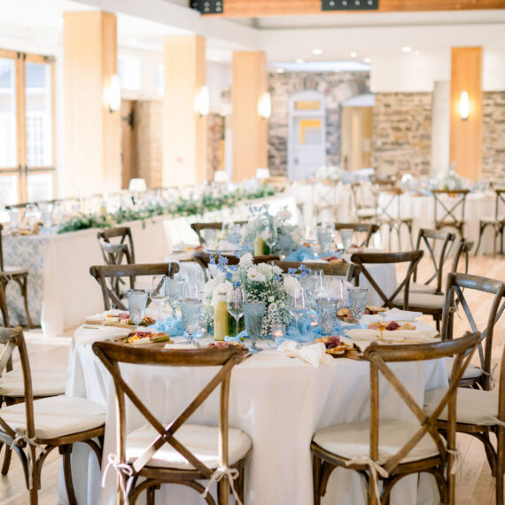 The Great Hall set with blue and gold place settings.