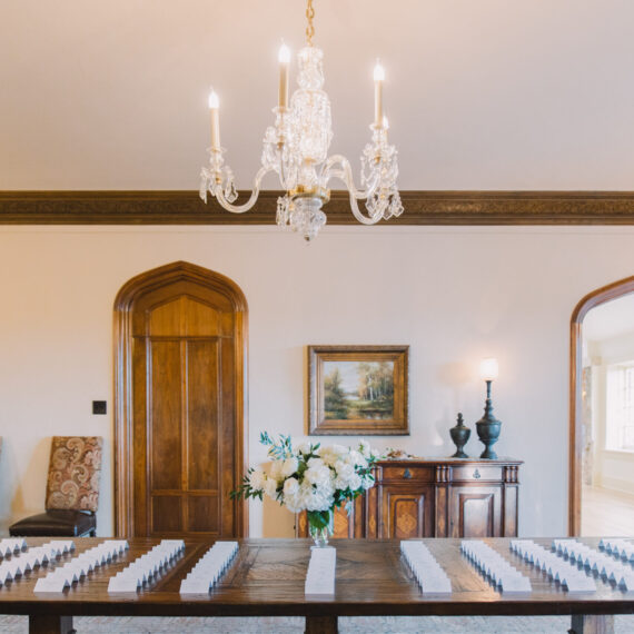 The Dining Room table lined with place cards, ready for guests to enter the reception.