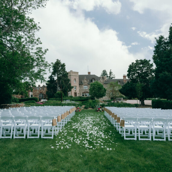 The East Lawn set for a ceremony with white folding chairs.